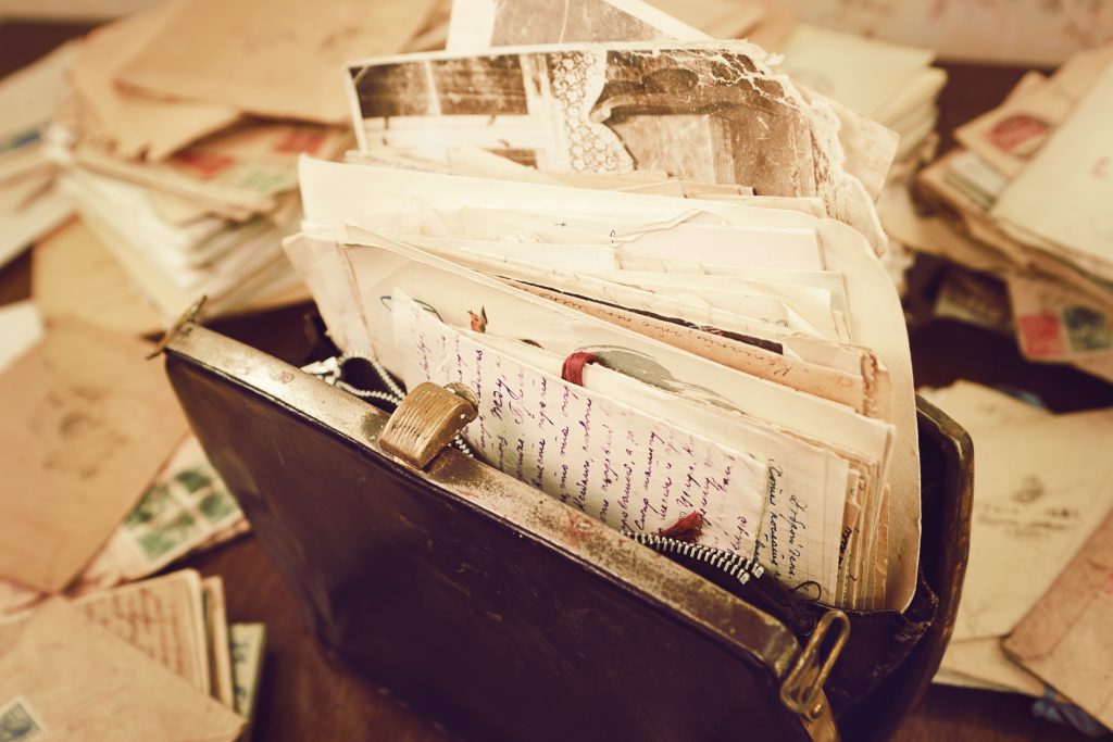 Old papers in a vintage briefcase